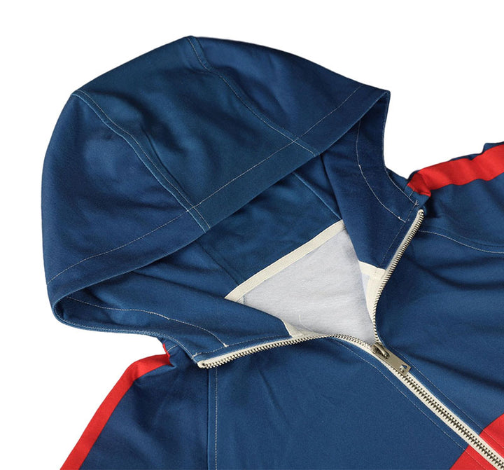 A close-up flat lay shot focusing on the premium sewing quality, zipper, and lined hood construction of a blue hoodie.