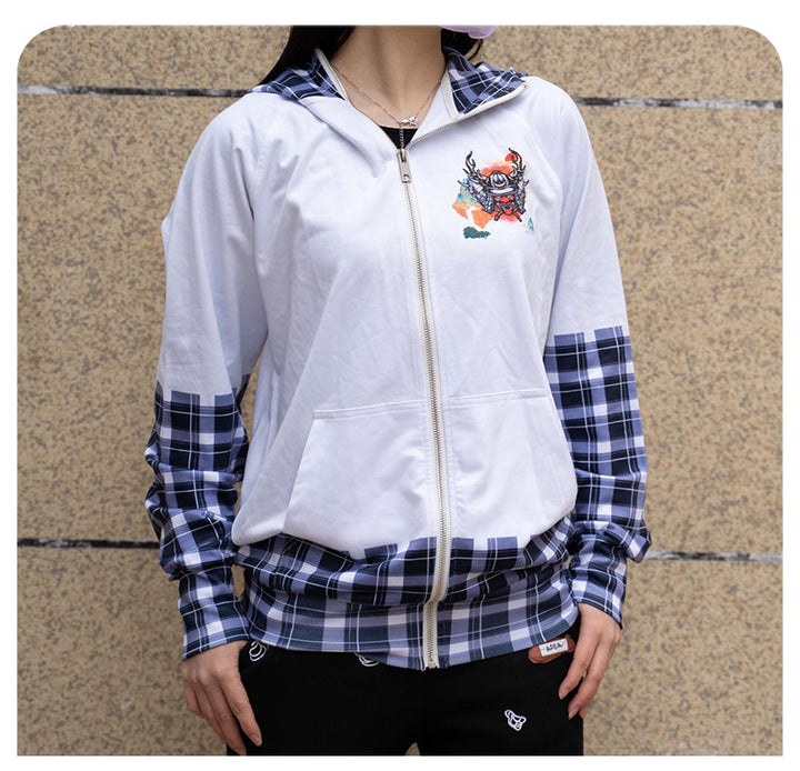 A model standing outdoors and wearing the personalized white custom zip-up hoodie with a blue checkered plaid lower hem.