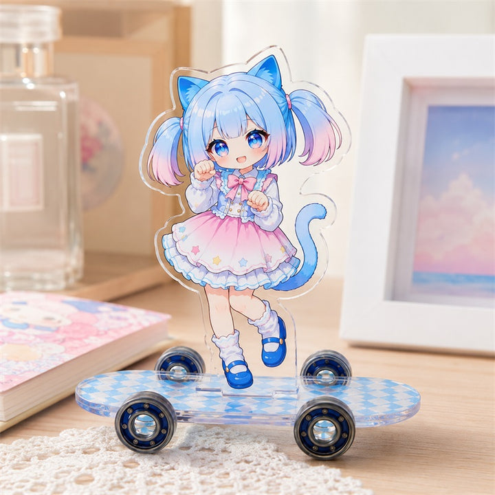 Custom clear acrylic skateboard standee with blue cat-girl artwork in a creator desk scene