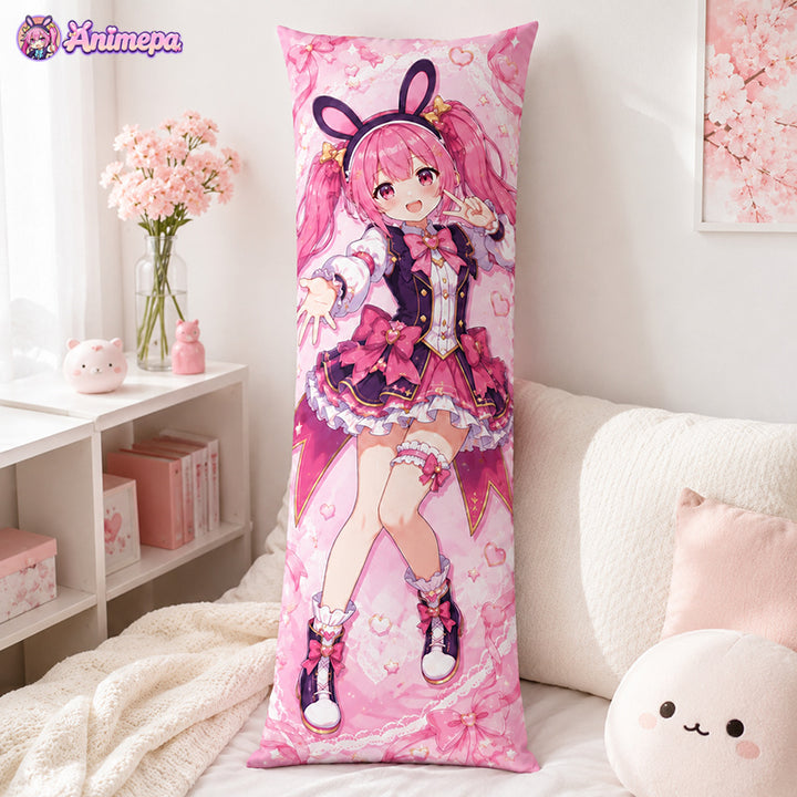 A standalone close-up of a premium pink anime idol character body pillow placed against a white sofa with room accessories.