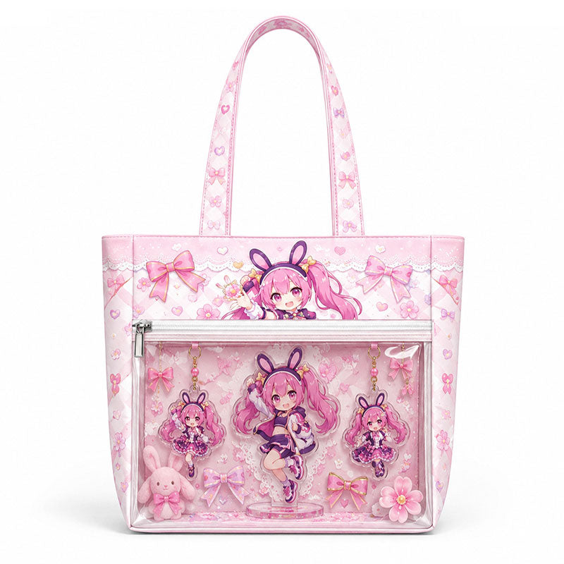 A light pink custom ita bag decorated with ribbons and a clear pocket showcasing anime plush charms.